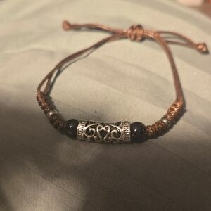 Rustic Silver and Brown Leatherlike Bracelet with Intricate Beads